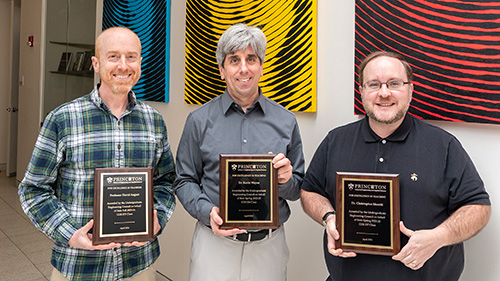 David August, Kevin Wayne and Christopher Moretti holding their awards