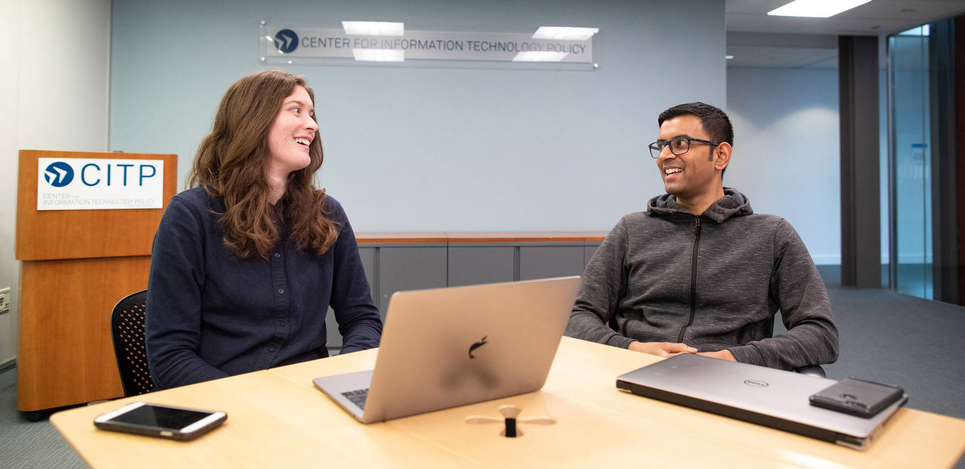 Elena Lucherini sitting across from Arvind Narayanan at the Center for Information Technology Policy.