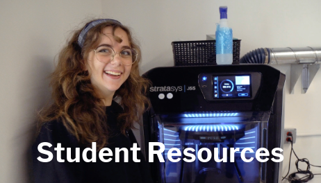 Student smiling in front of 3D printer